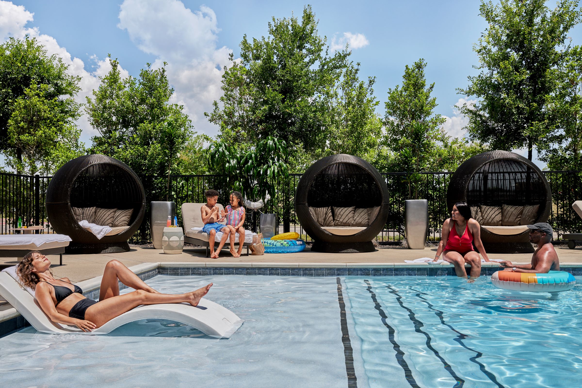 a group of people sitting in a pool