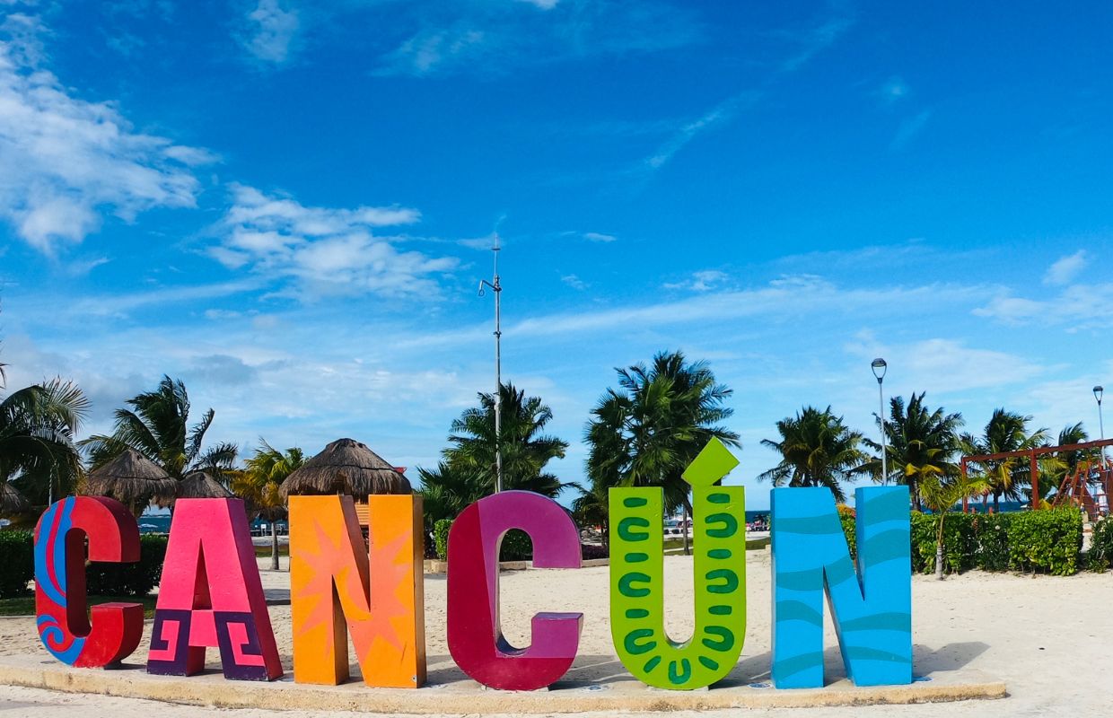 a large colorful letters on a beach