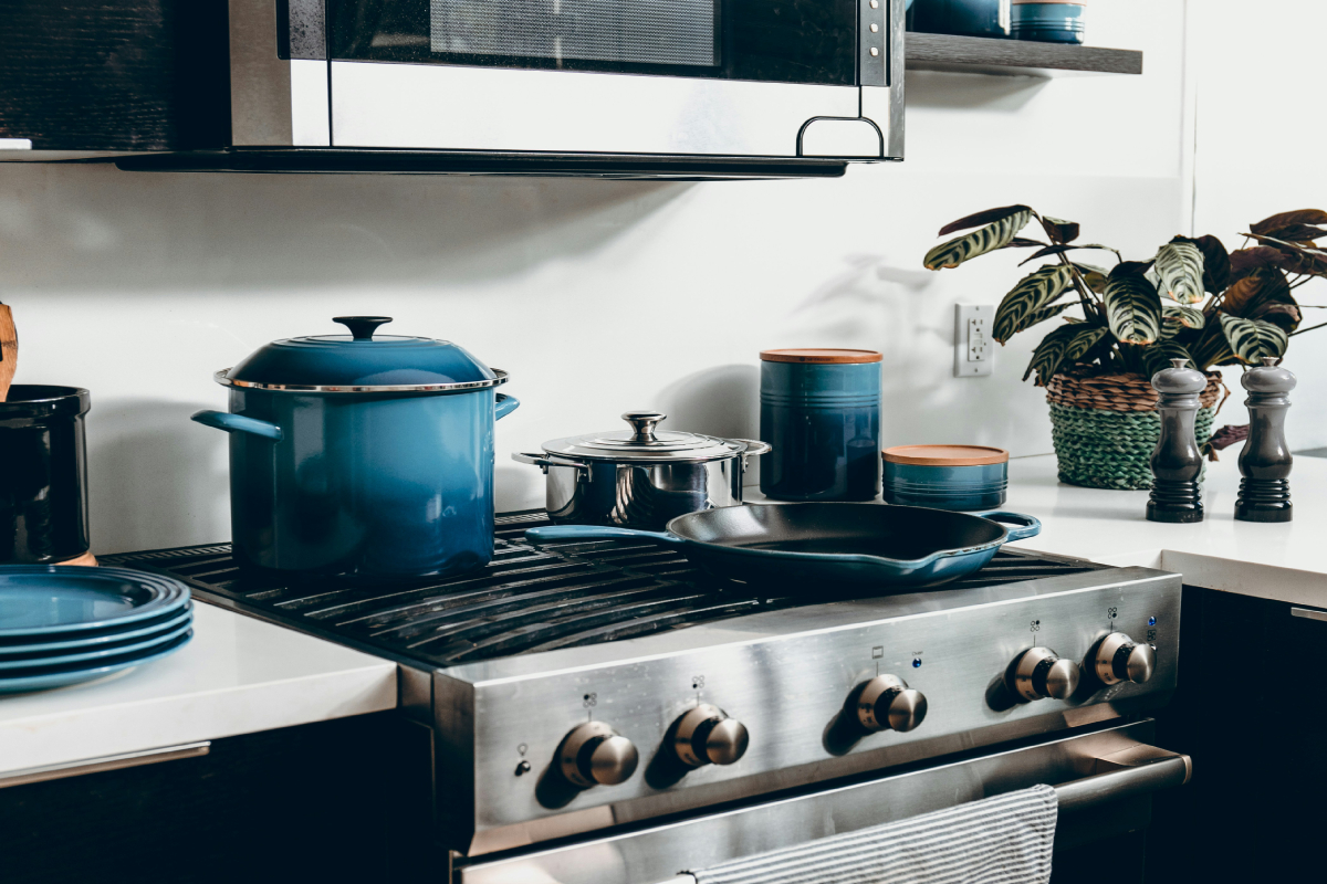 a kitchen with pots and pans on a stove