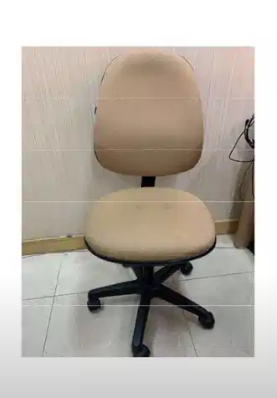 a tan office chair with wheels