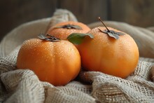 a group of oranges on a cloth