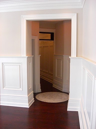 a hallway with a round rug