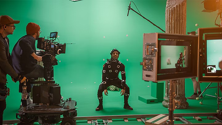 a man in a helmet and helmet with a green screen behind him