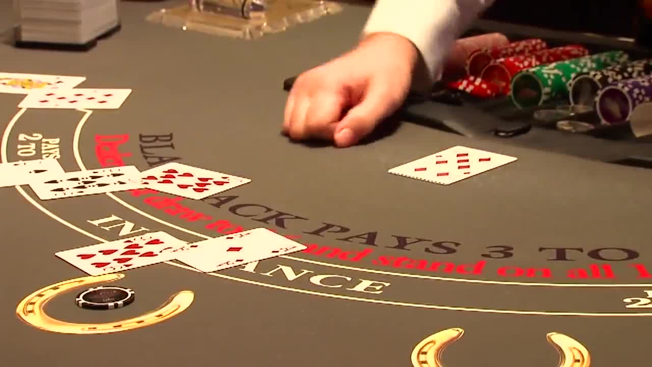 a person playing poker at a table