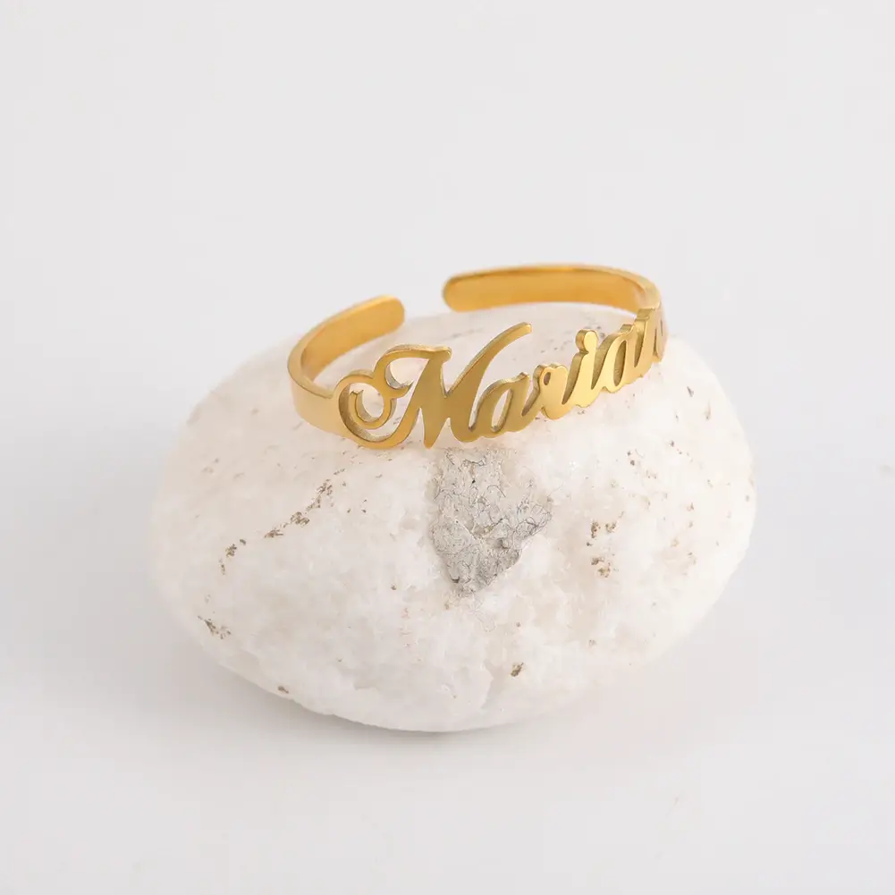 a gold ring on a white stone