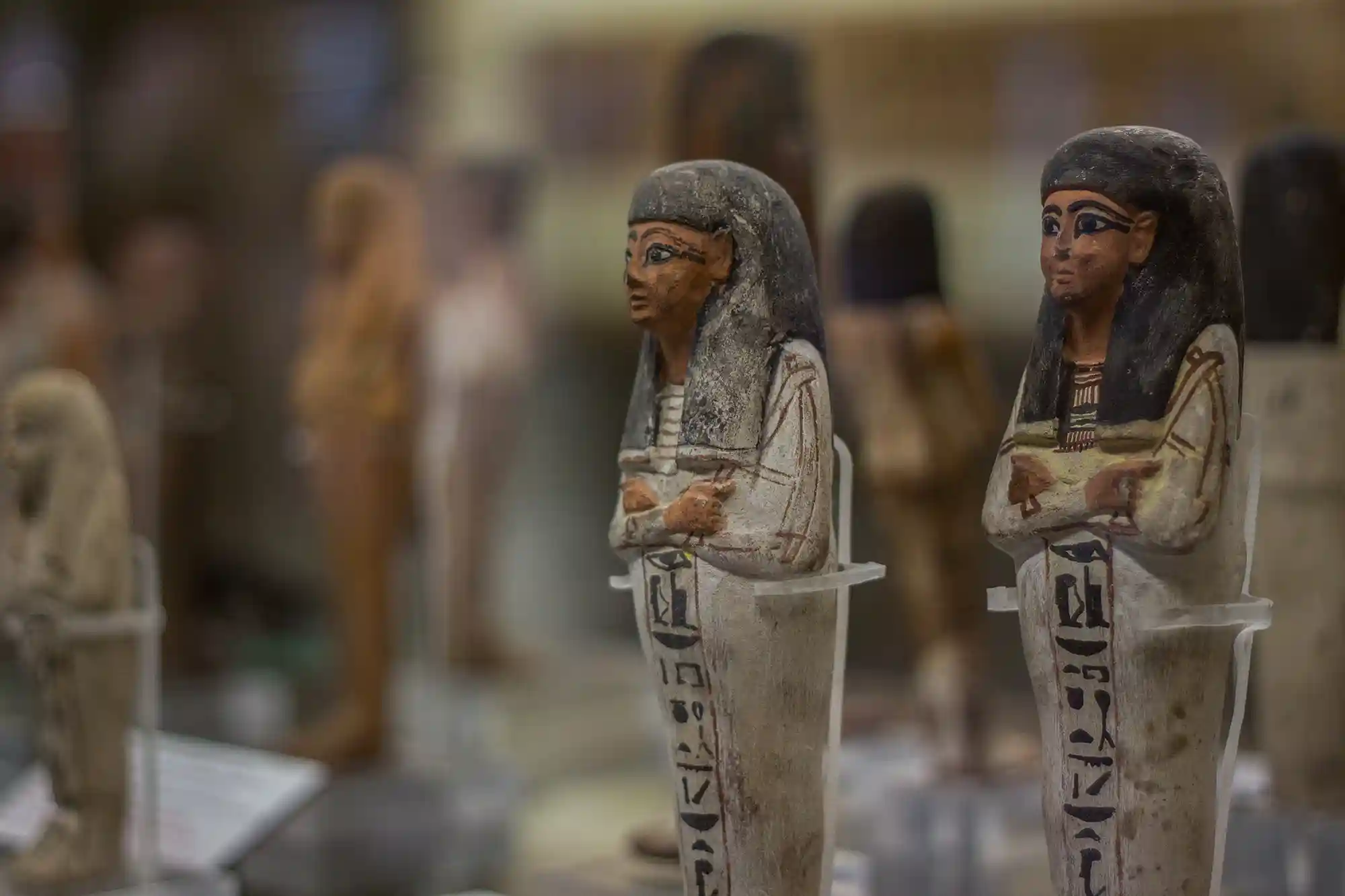 a group of statues in a display case