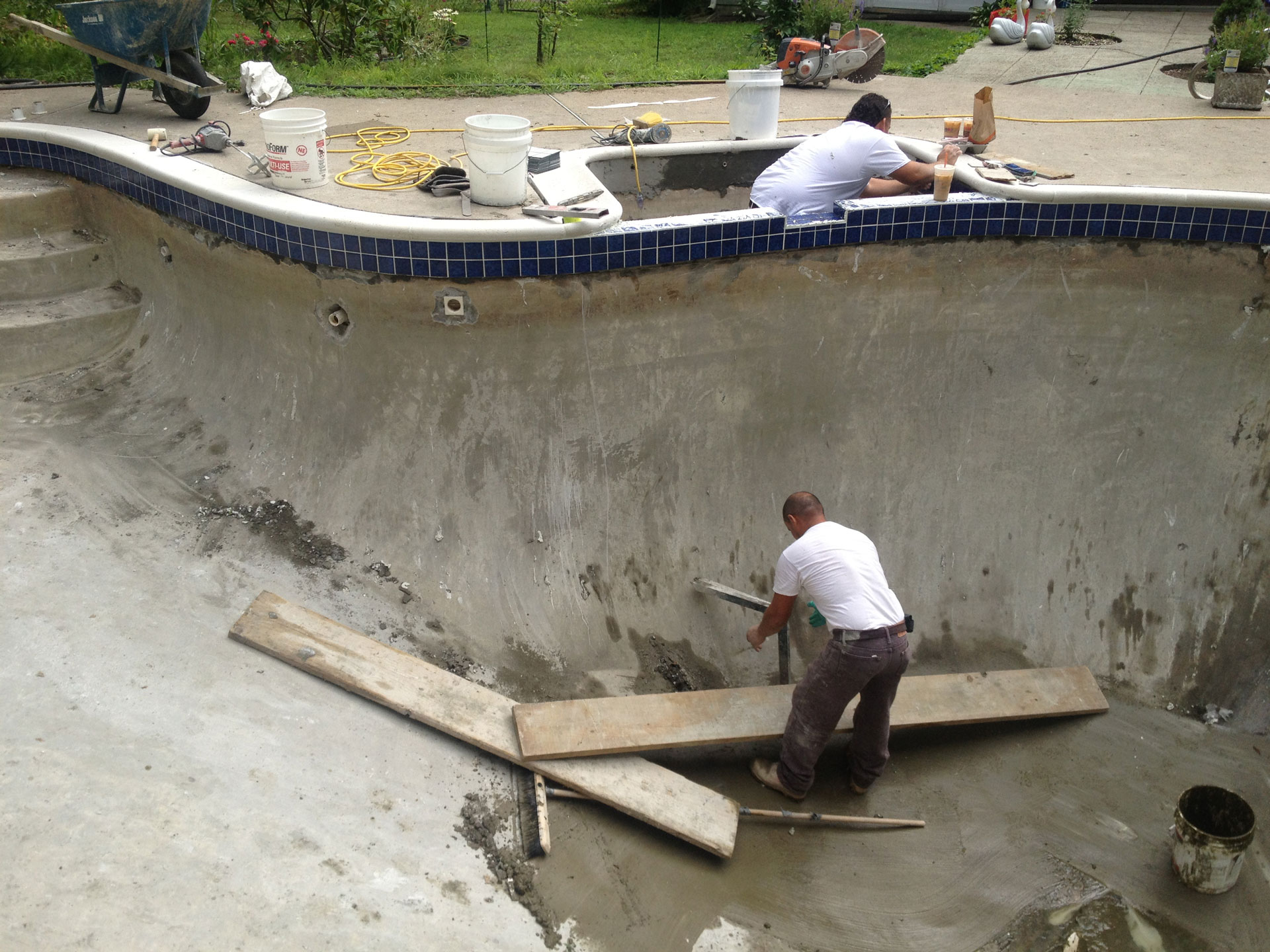 a man working on a pool