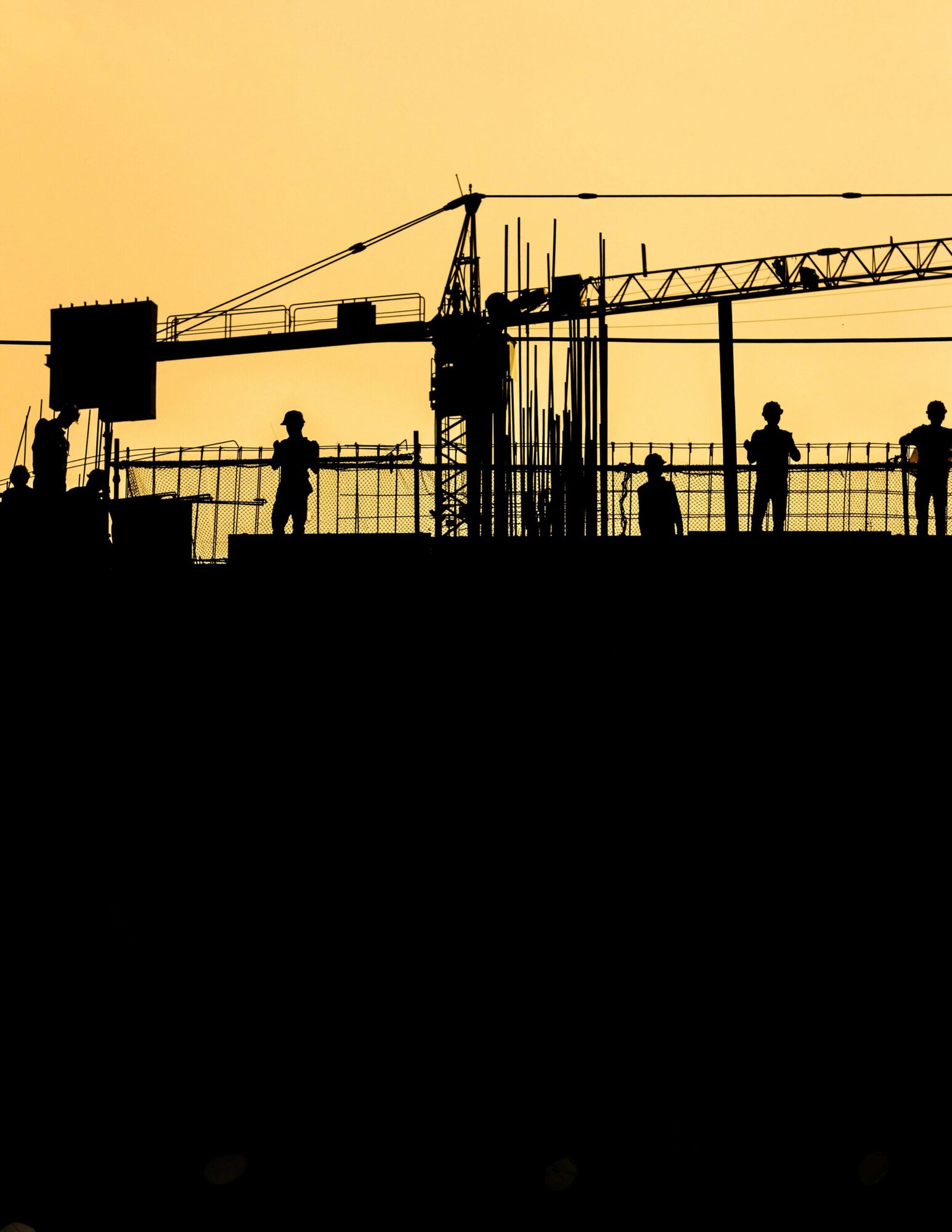 a group of people standing on a construction site