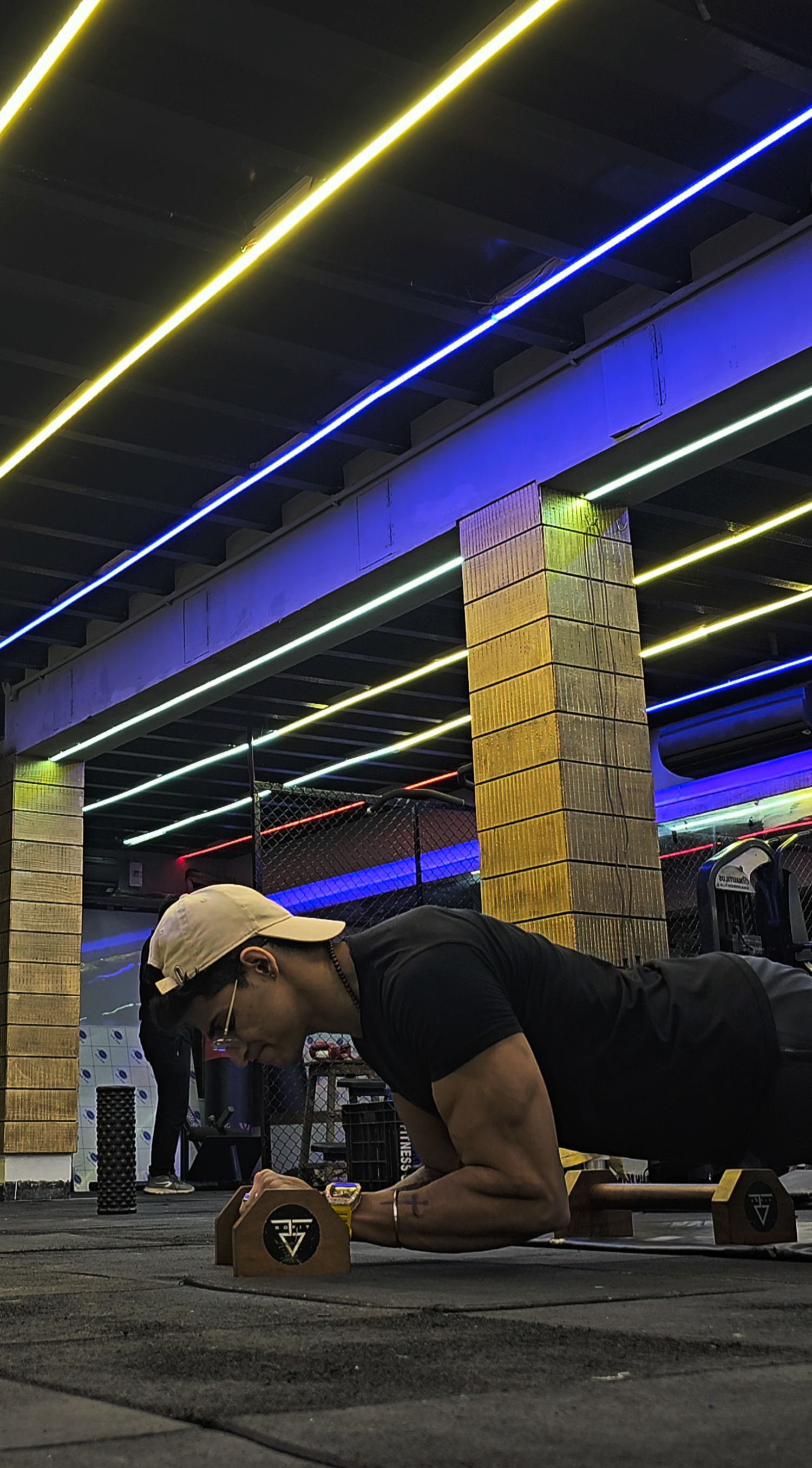 a man doing push ups in a gym