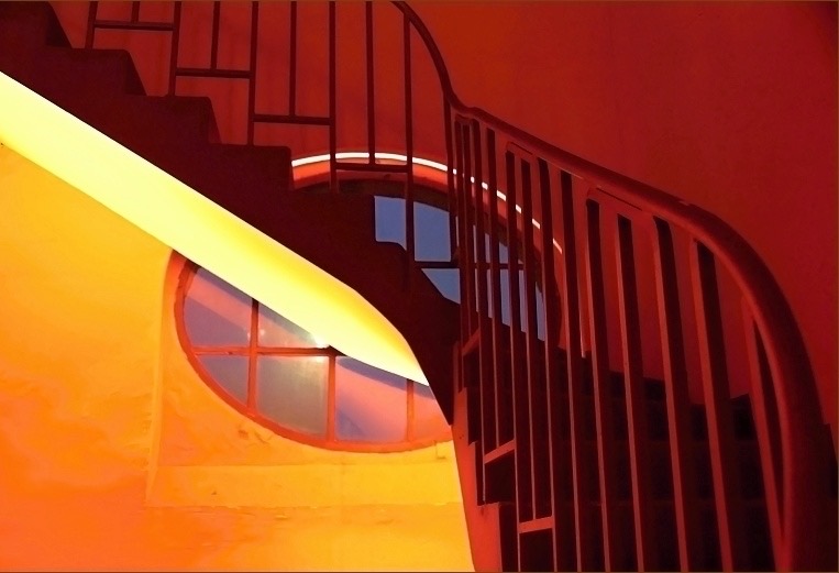 a spiral staircase with a window
