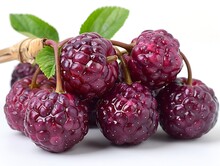 a bunch of raspberries with leaves