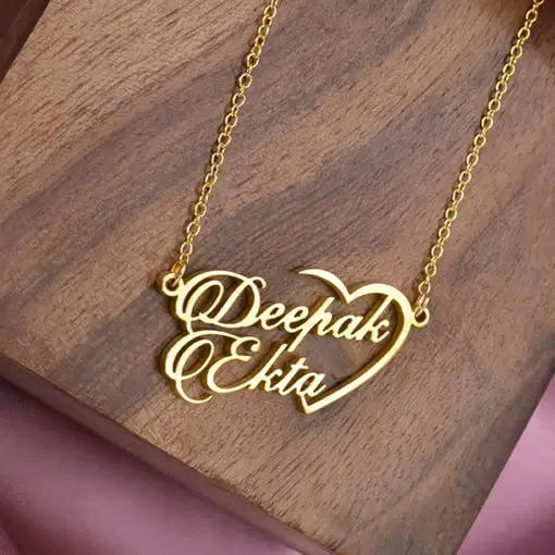 a gold necklace with a heart on it