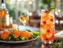 a plate of fruit and a glass of drink