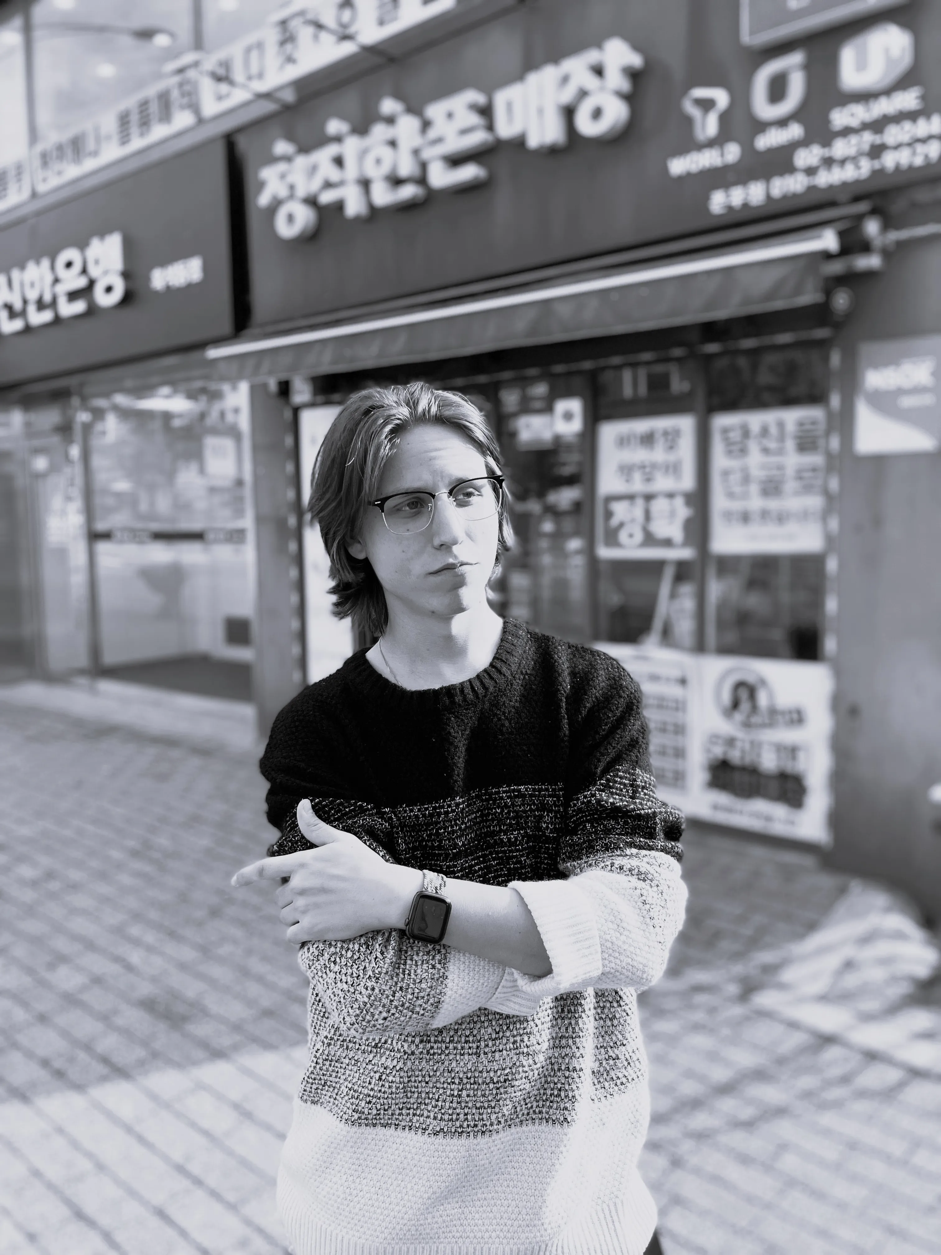 a man standing outside a store