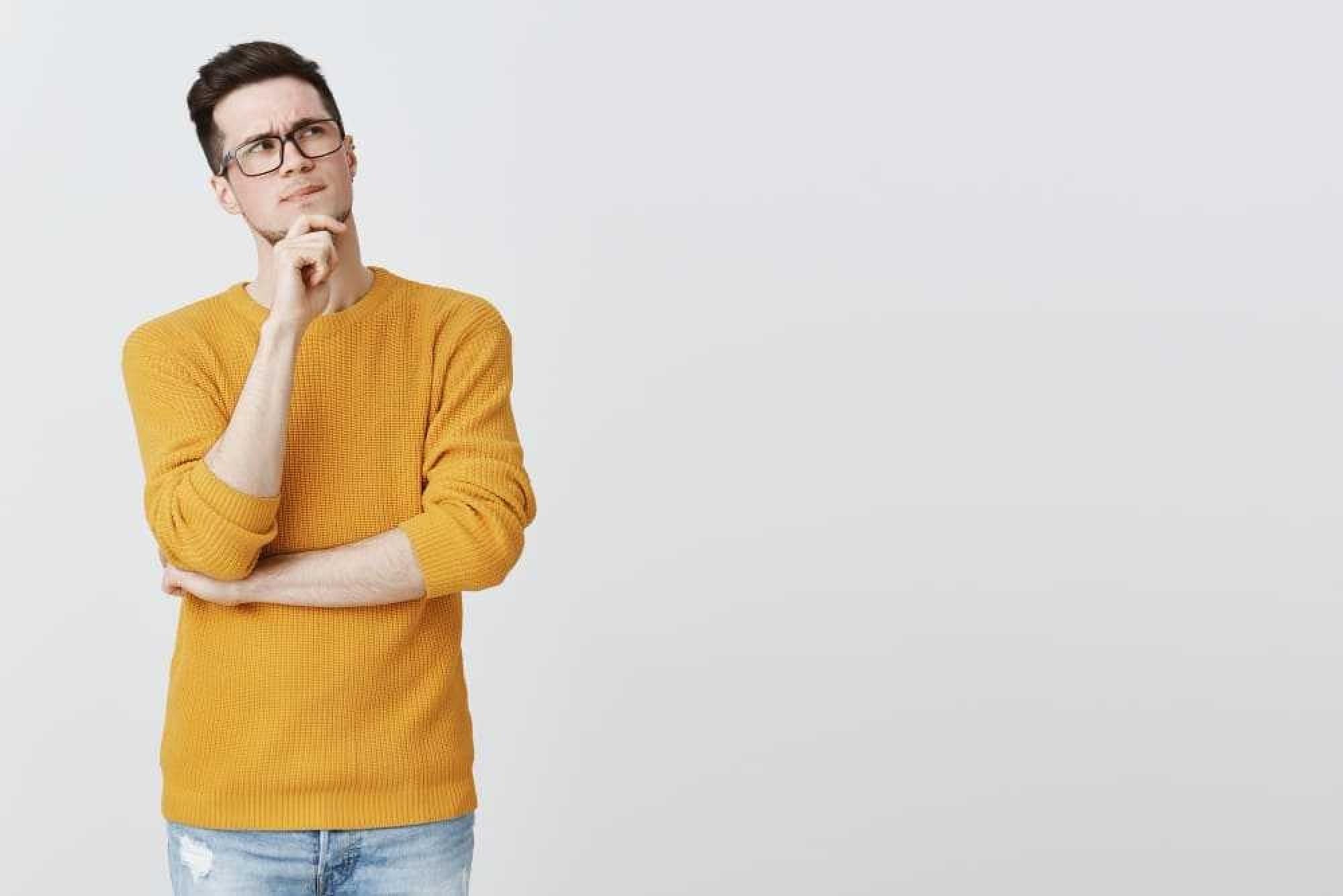 a man in a yellow sweater