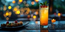 a glass of orange liquid with a slice of fruit on a plate