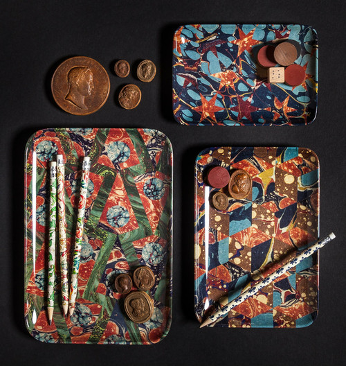 a trays with pencils and coins