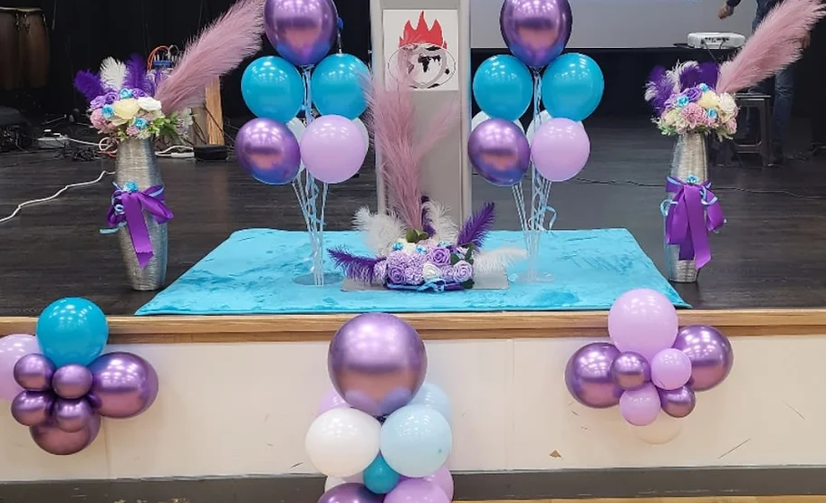 a group of balloons on a stage