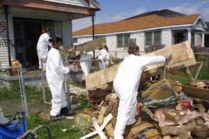 a group of people in white overalls