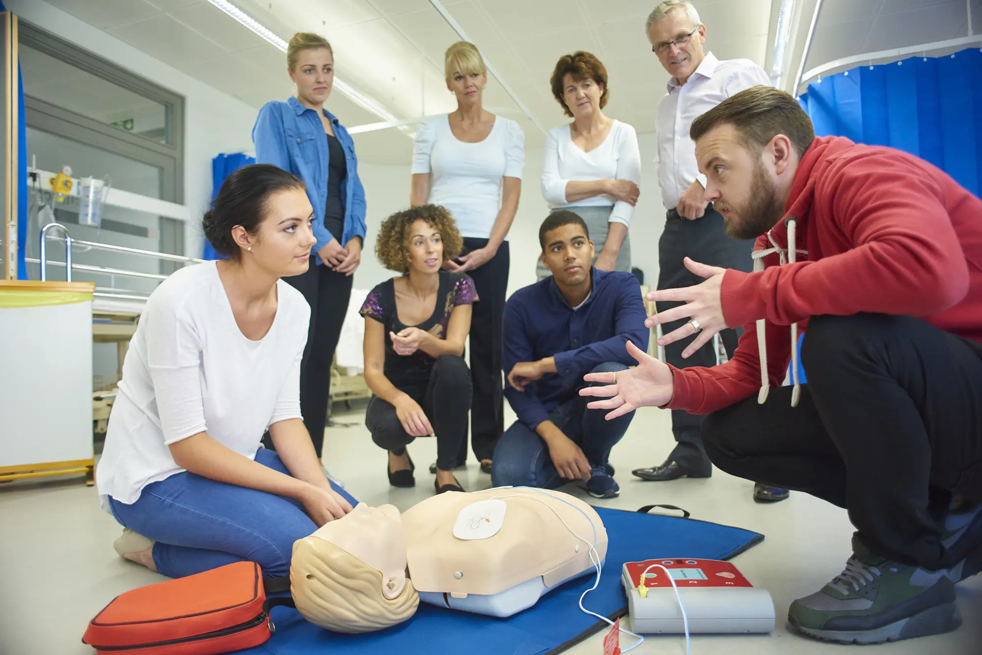 a group of people looking at cpr