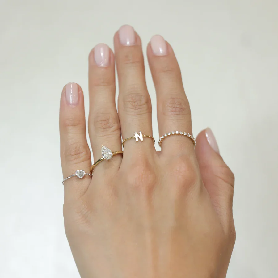 a hand with rings on it