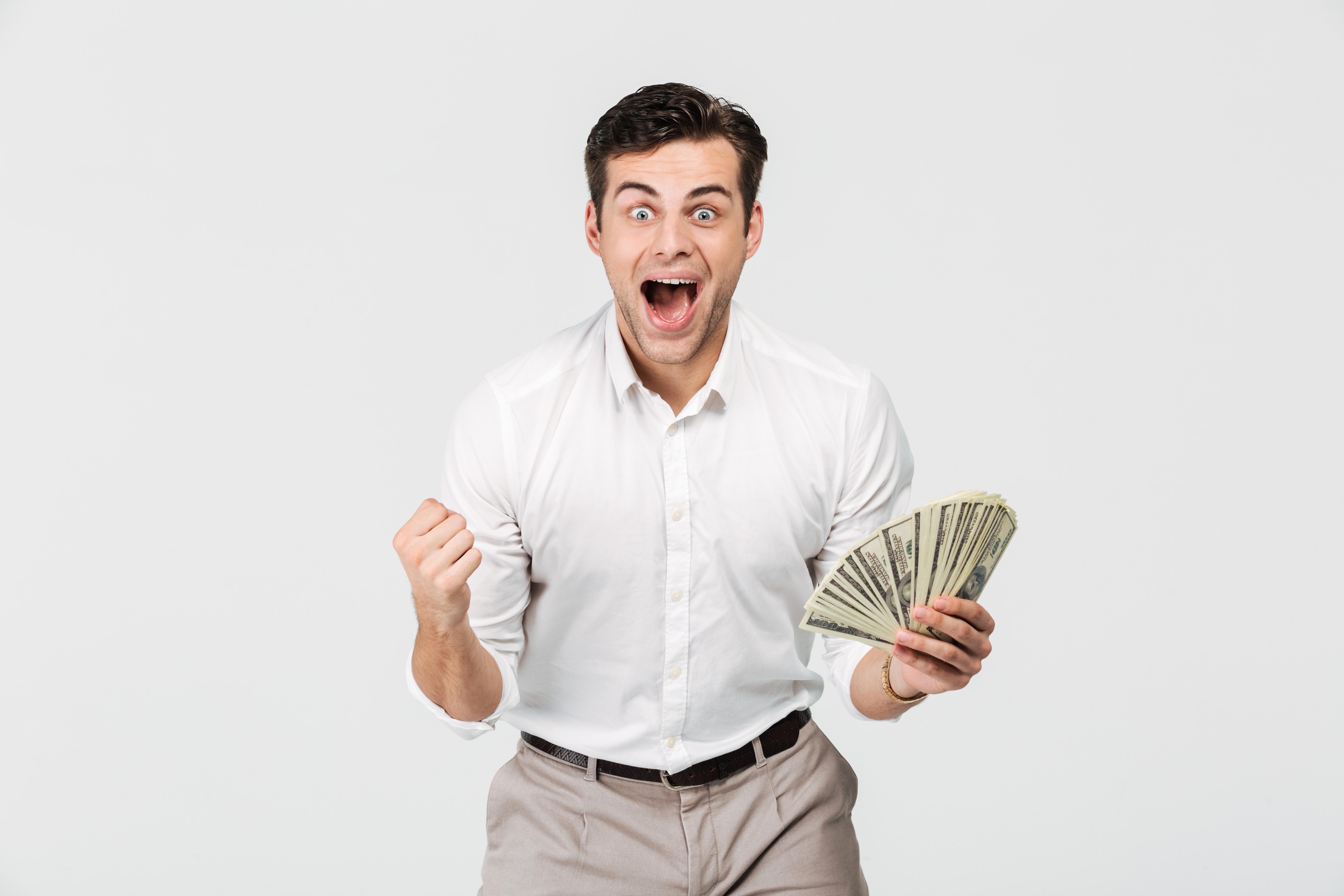 a man holding money and cheering