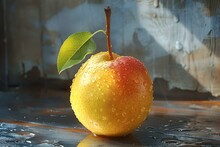 a yellow apple with a green leaf