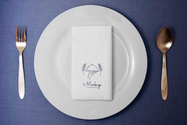 a white plate with a napkin on it