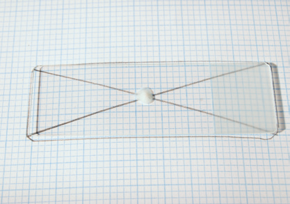 a glass rectangle with a string on top