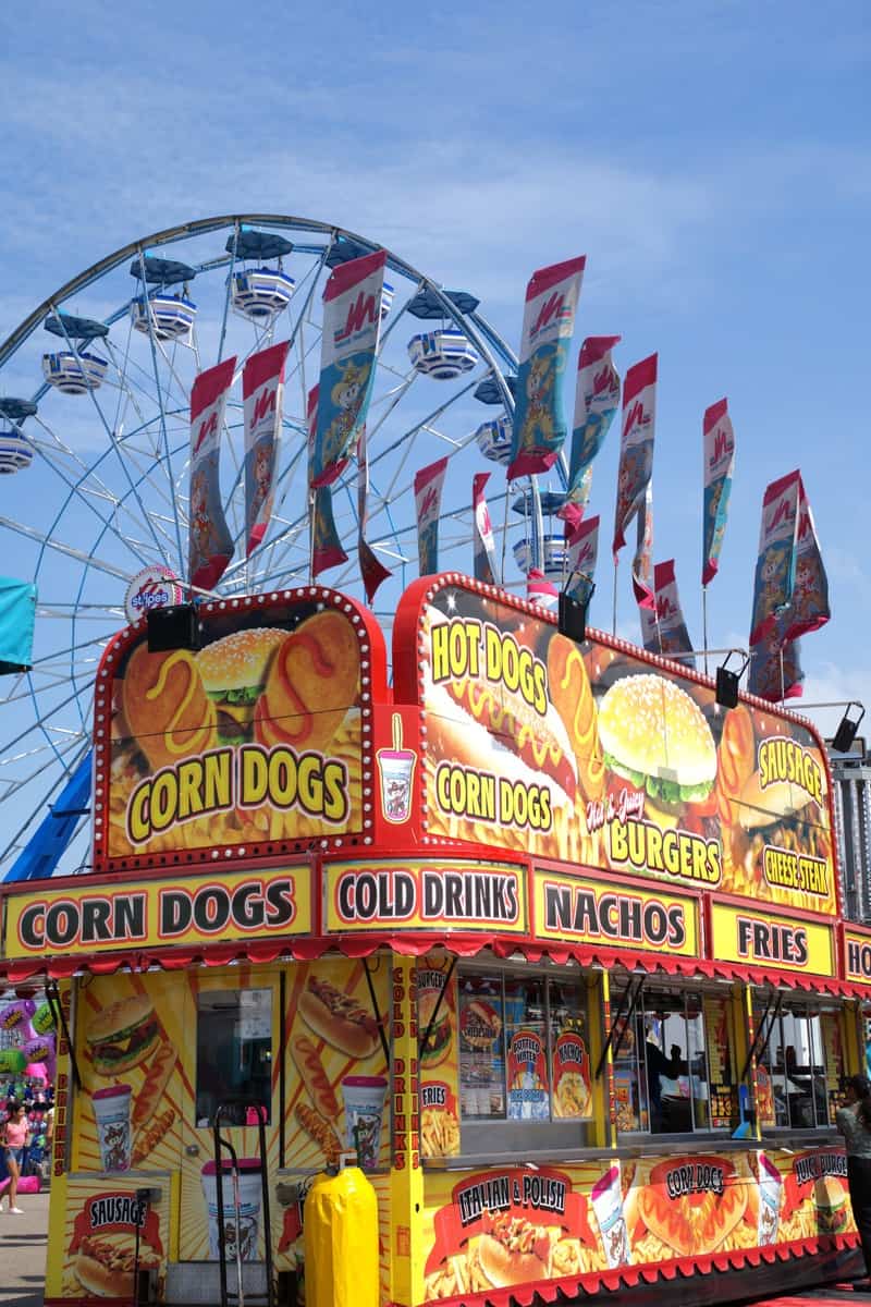 a food stand with a ferris wheel