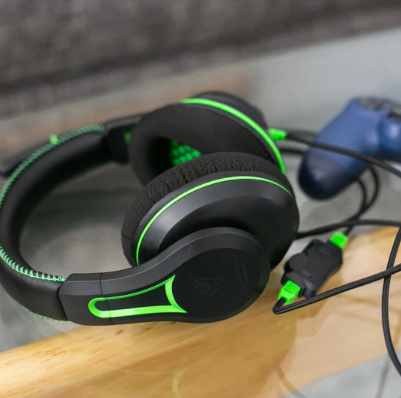 a pair of black and green headphones