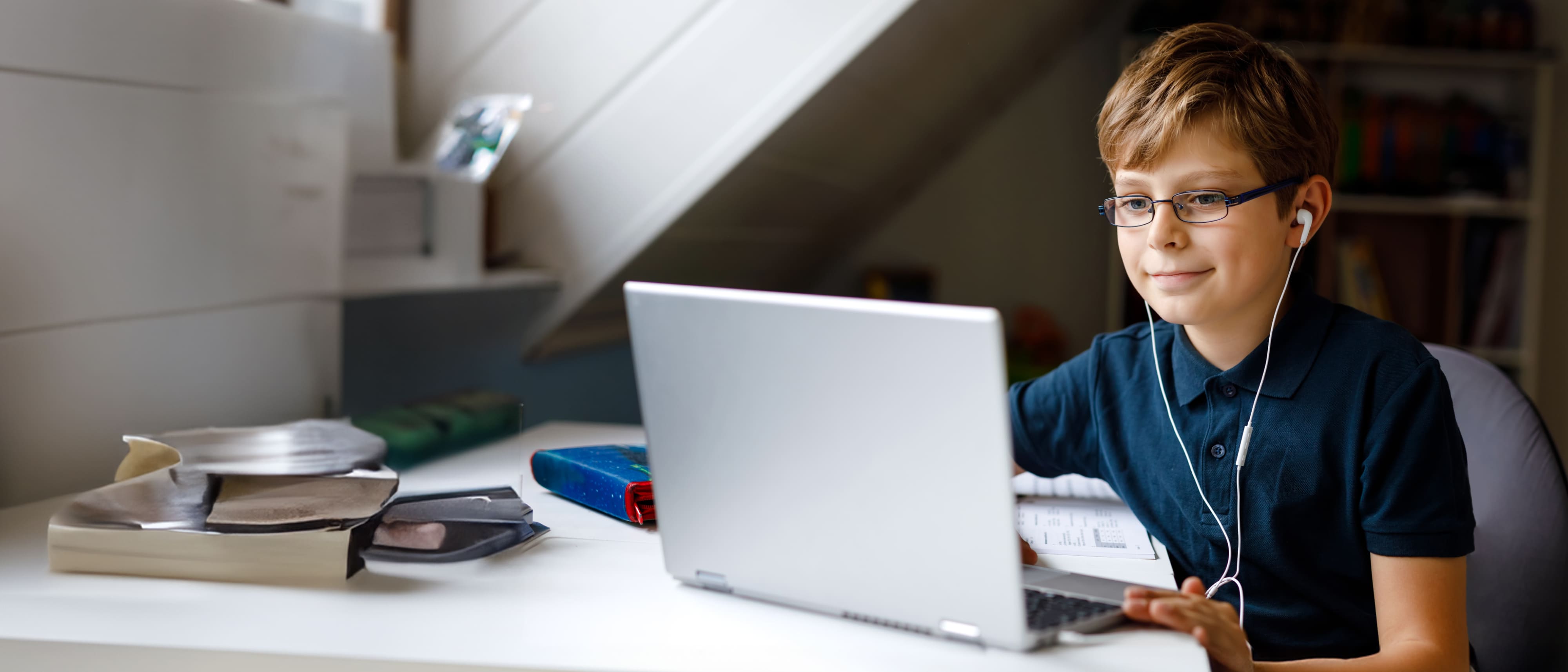 a boy using a laptop