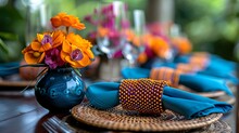 a table with a blue and orange napkins