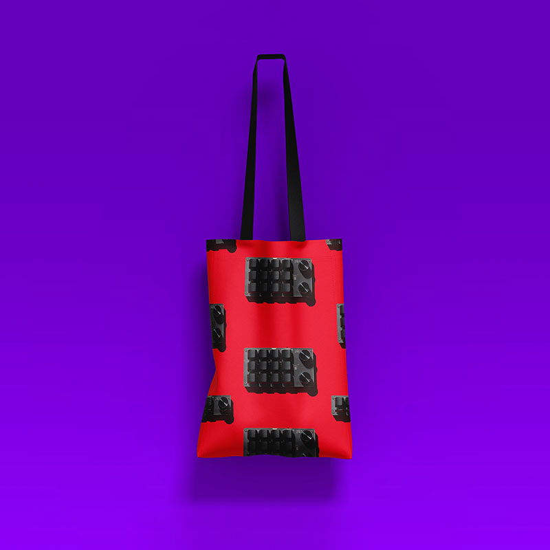 a red bag with black keys on it