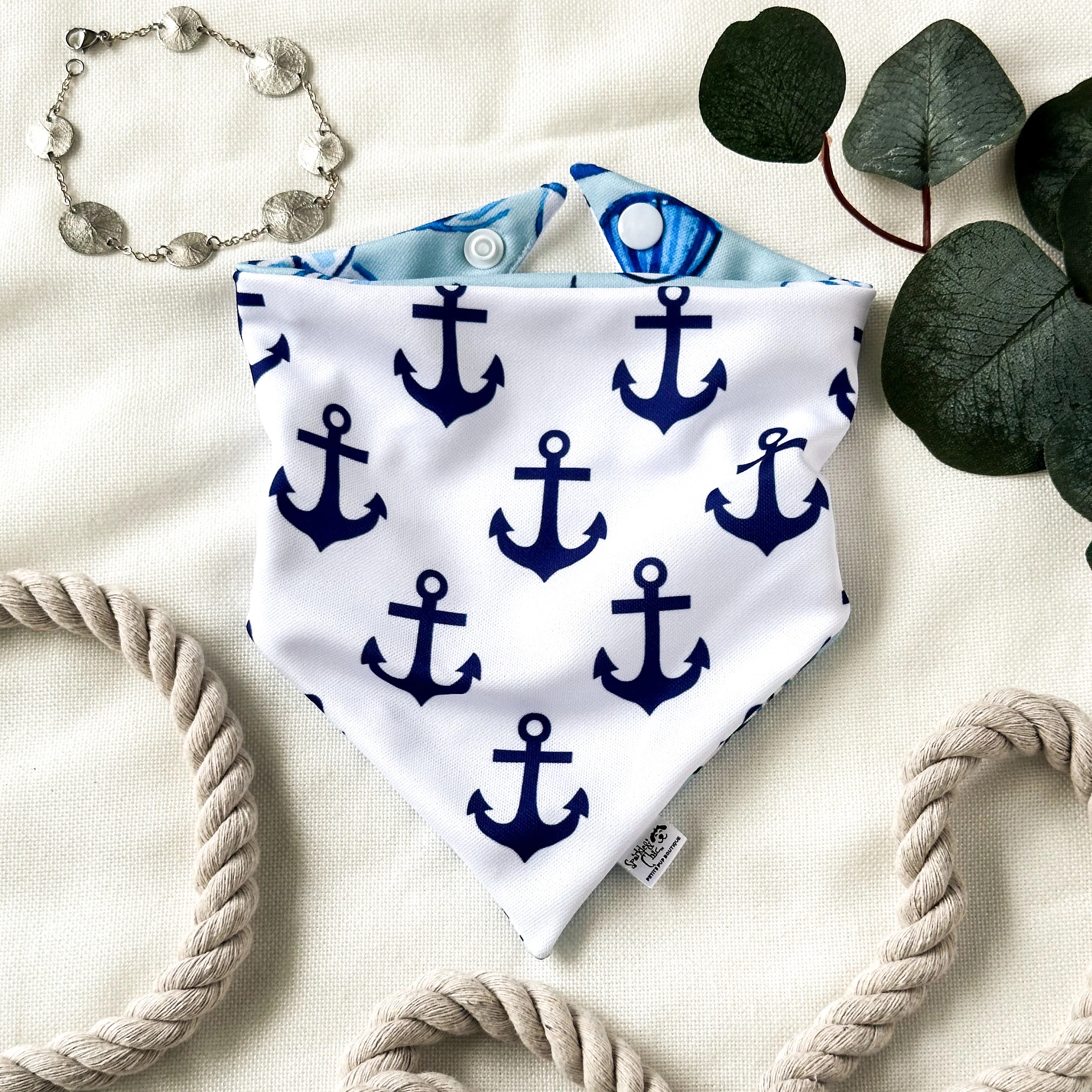 a bandana with anchors and rope around it