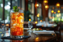 a glass of ice tea on a table