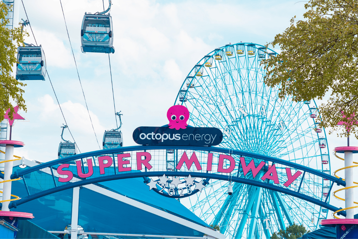 a ferris wheel and a sign