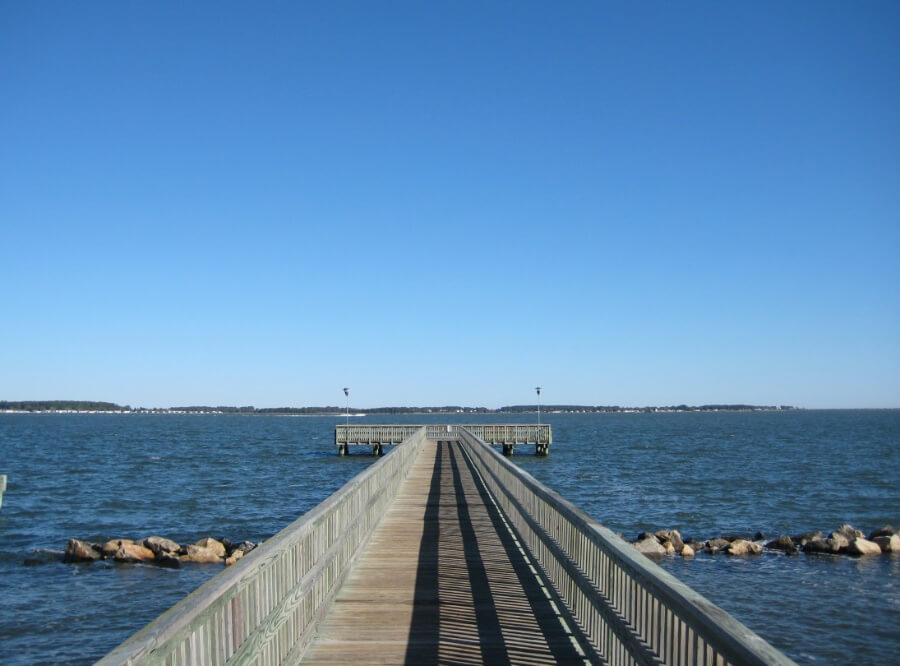 a long wooden dock over water