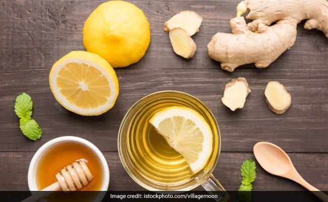 a cup of tea with lemons and ginger