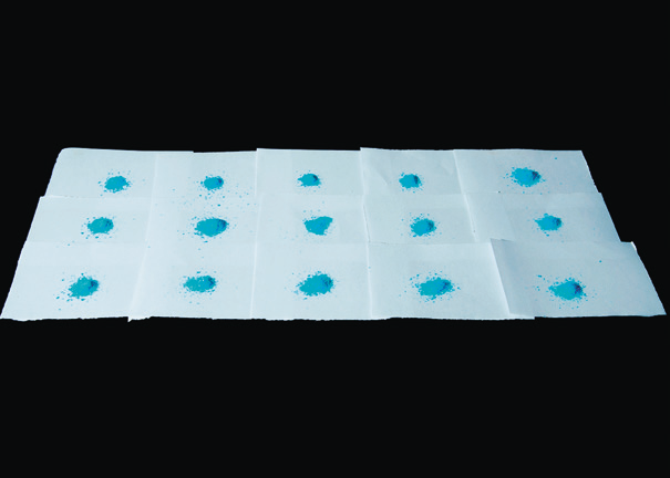 a group of blue blots on paper