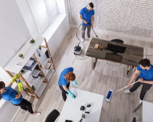 a group of people cleaning a room