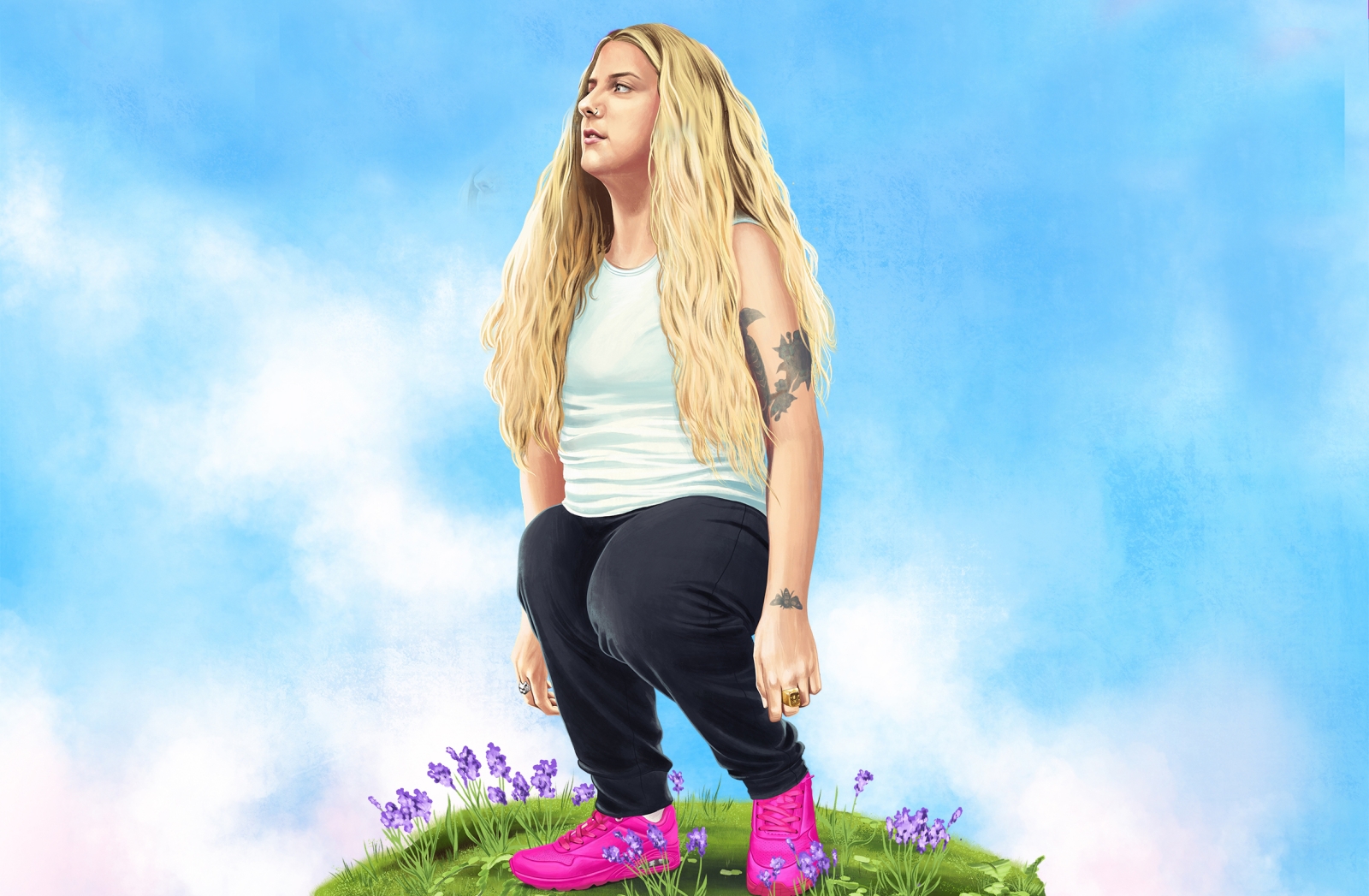 a woman standing on a grass hill