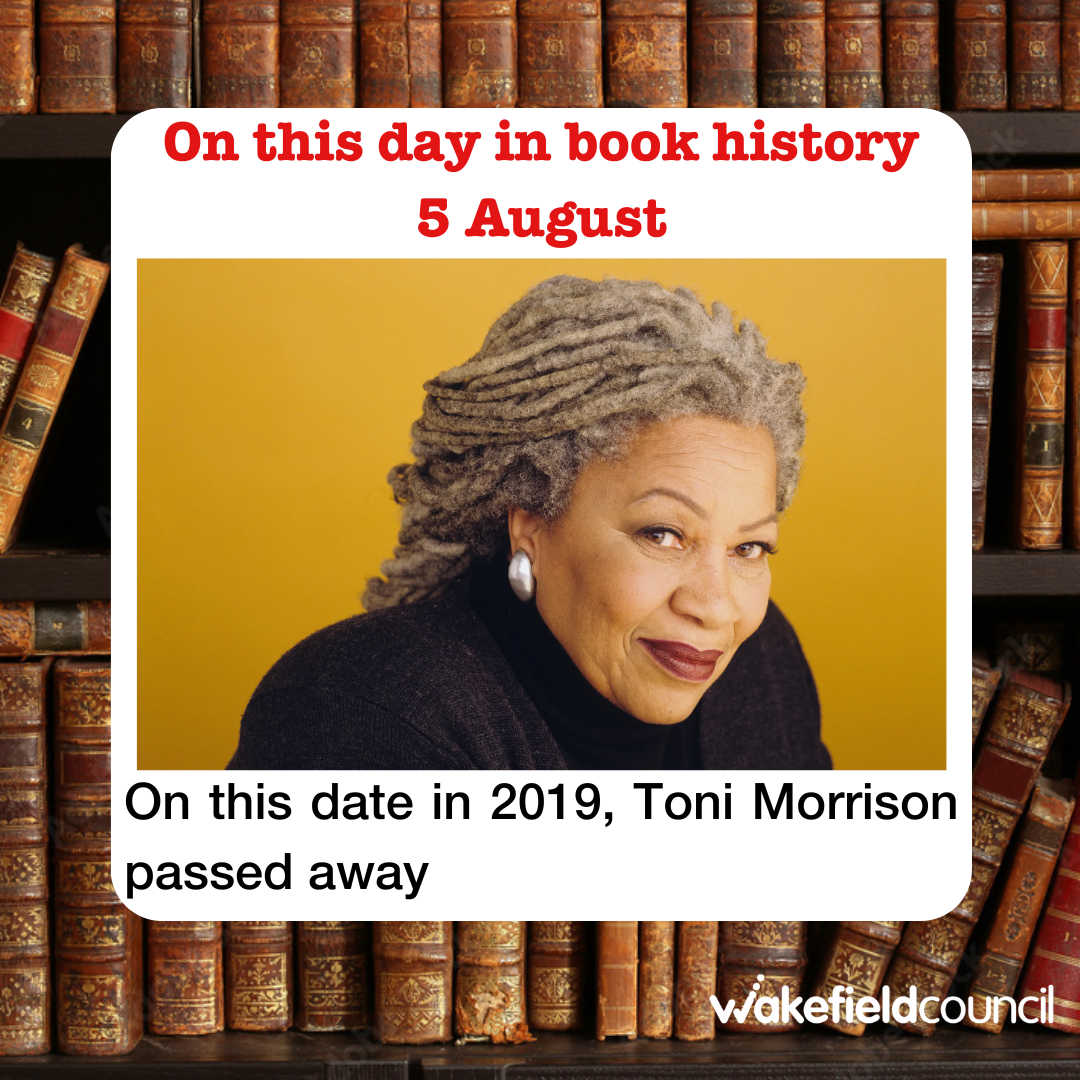 a woman with dreadlocks in front of a book shelf