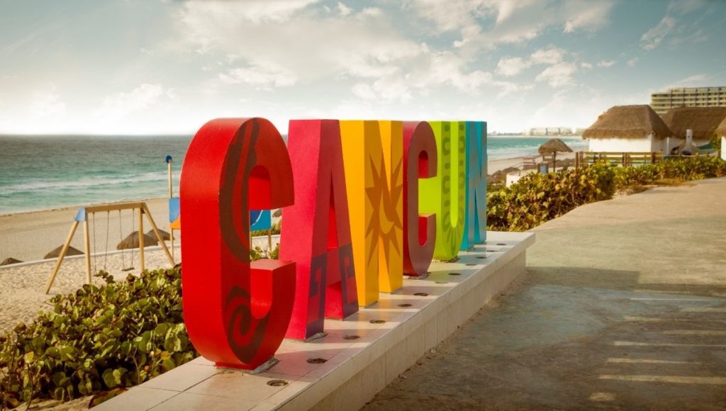 a colorful sign on a beach