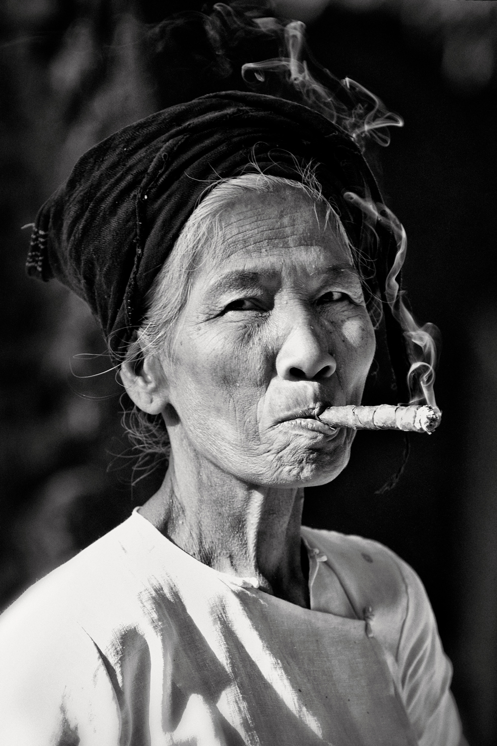 a woman smoking a cigar