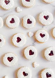 a group of cookies with jam inside