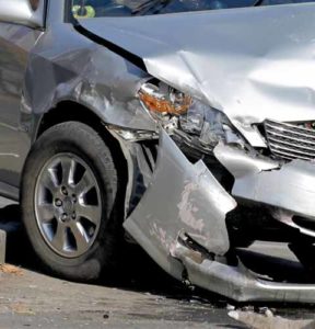 a close-up of a damaged silver car