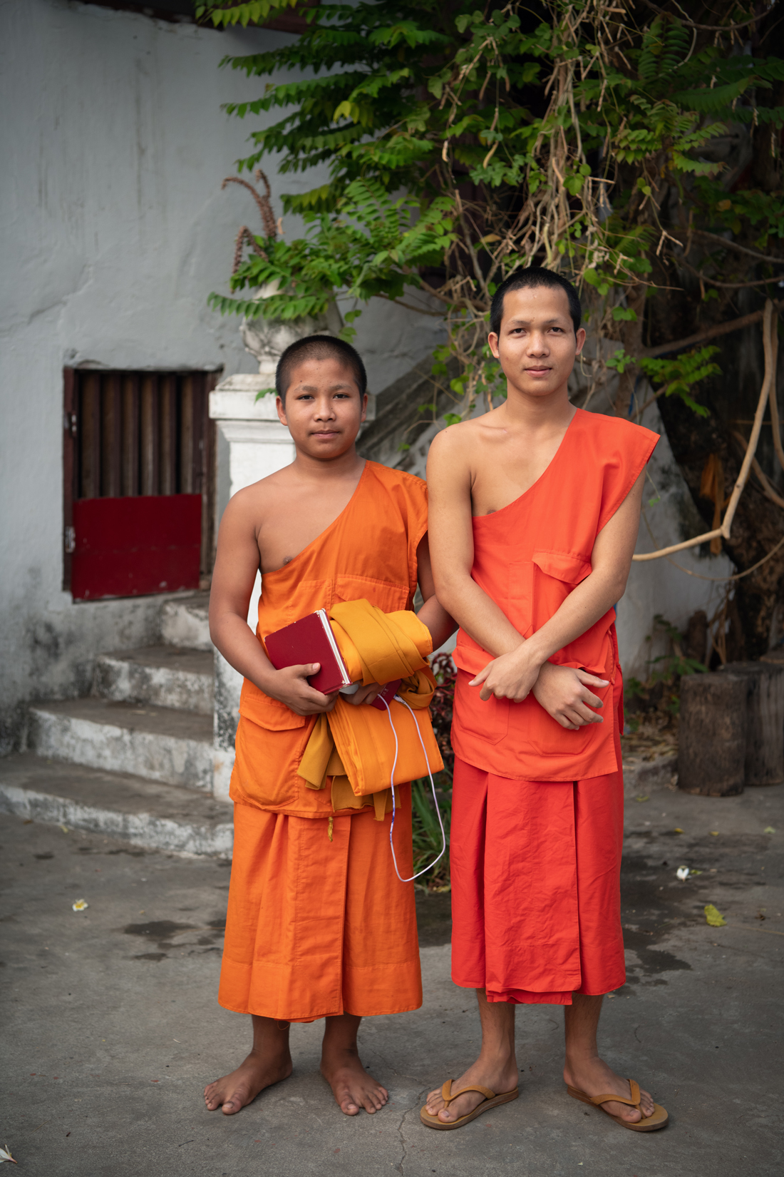 two boys wearing orange robes