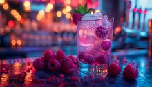 a glass of raspberries and ice on a table