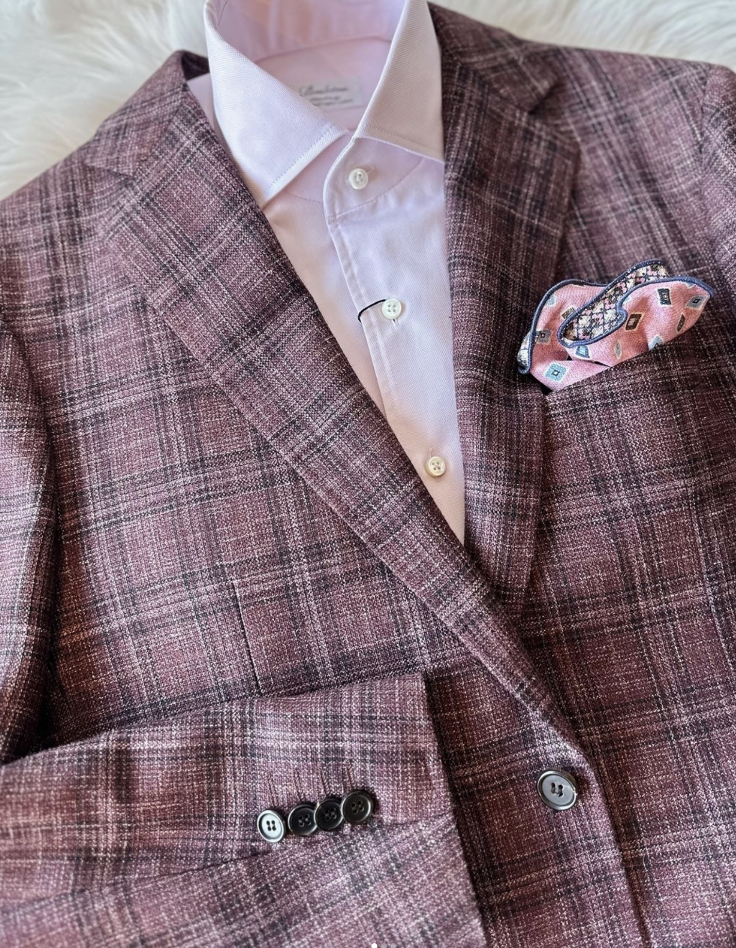 a suit jacket with a pocket square and a pocket square